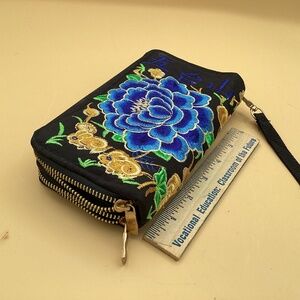 Blue embroidered wristlet